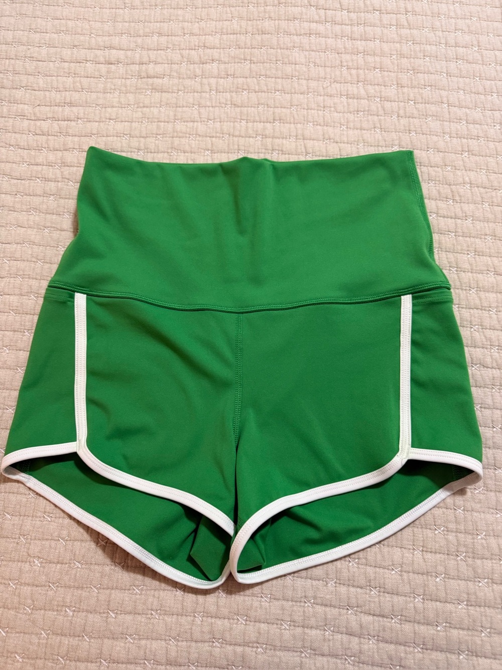 Free People High Waist Green Athletic Shorts with White Trim.